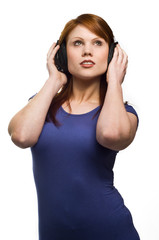 Beautiful young Redhead woman with headphones