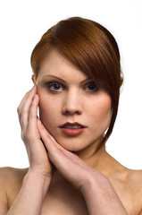 Obraz premium Beautiful young red haired woman isolated on a white background