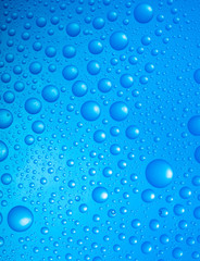 water drops over blue background