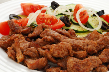 Grilled meat with vegetable salad