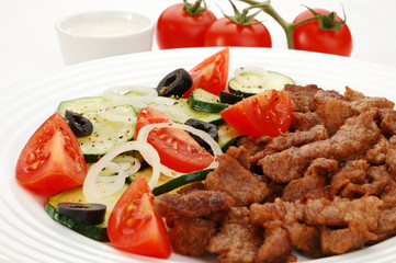 Grilled meat with vegetable salad