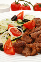 Grilled meat with vegetable salad