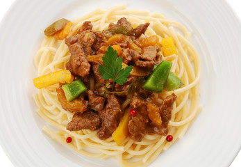 Pasta with meat and vegetables isolated on white background