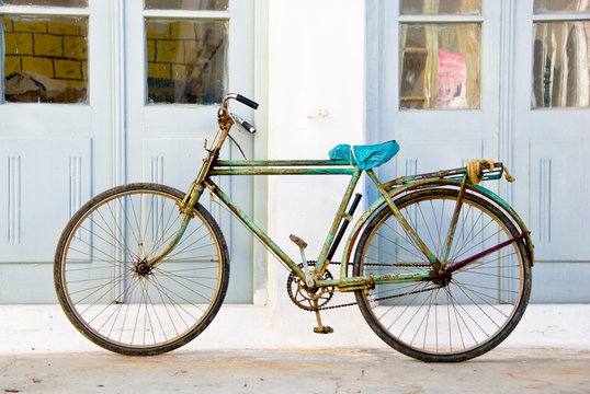 rusted green bicycle