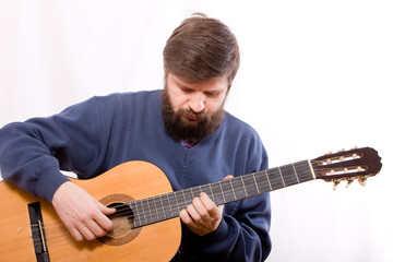 Obraz premium playing on acoustic guitar