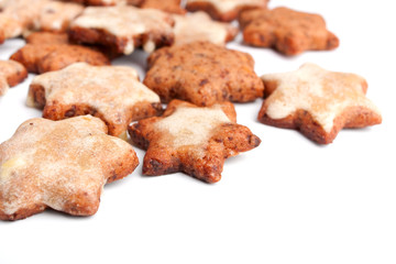 a group of star-shaped homemade christmas cookies