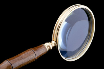 magnifying glass on black close up
