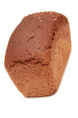 Loaf of dark bread isolated on white.