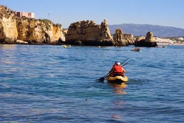 two persons are kayaking in sea,ocean at the morning