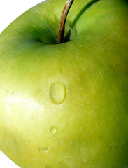Part of green apple with some waterdrops