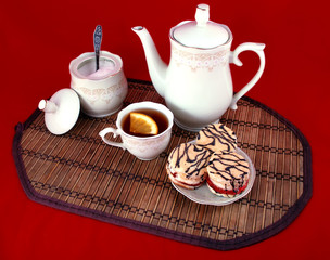 beautiful still life cup of tea and some delicious pastries