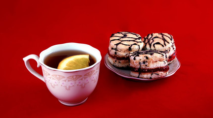 beautiful still life cup of tea and some delicious pastries