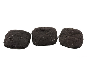 three charcoal briquets