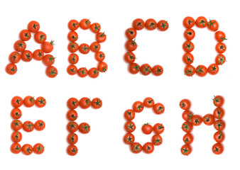 Letters of English alphabet formed from tomatoes