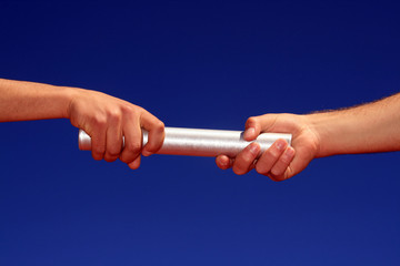 hands passing the batton