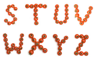 Letters of English alphabet formed from tomatoes