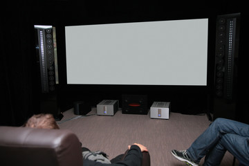 People in home cinema