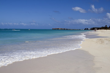 Beach in Antigua with the white sands and blue water
