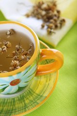 camomail tea in floral colorfull cup