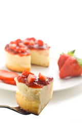 cheesecake with fresh strawberries and blackberry jam