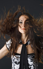 closeup portrait of woman dancing and flipping her hair