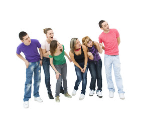 Obraz premium happy group of teenagers looking towards something