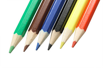 Close-up of various coloured pencils on white background