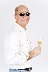 Handsome Latin Man Holding a Glass of Pink Champagne
