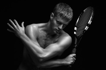 Tennis player with racket