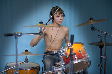 Fototapeta premium A young male drummer in action