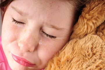 Young girl upset with bear