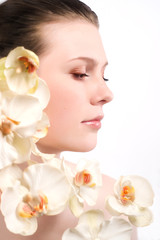 The beautiful young woman with flowers