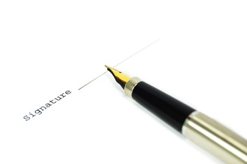 A document with a place for a signature and a gold nibbed pen