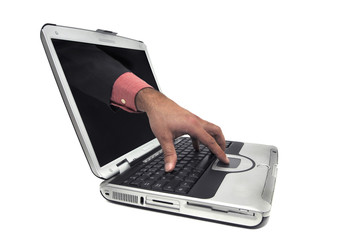 Laptop with hand on keyboard