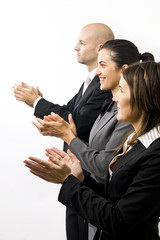 Businessteam in a row clapping