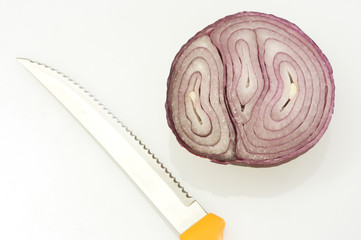 red onion sliced in half by steel orange knife