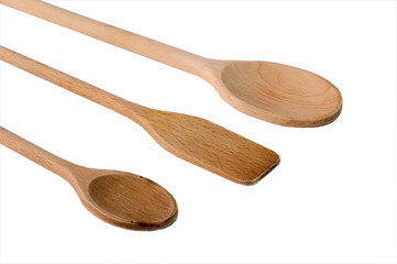 Wooden spoons on white background