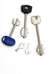 5 silver keys on white background