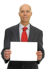 Businessman with a big card isolated against a white background