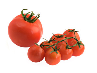 Large tomato and branch of cherry tomatoes