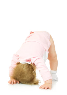 Small girl makes gymnastic exercise isolated