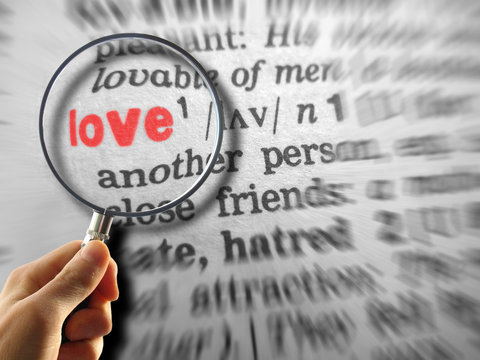 Definition of love with magnifying glass and blur effects
