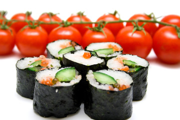 Japanese sushi and ripe red tomatoes