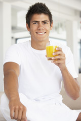 Young Man Drinking Orange Juice