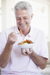 Middle Aged Man Eating Salad