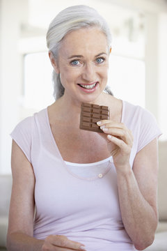 Senior Woman Eating Chocolate