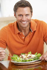 Middle Aged Man Eating A Healthy Meal
