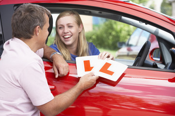 Teenage Girl Receiving Her Learner Plates
