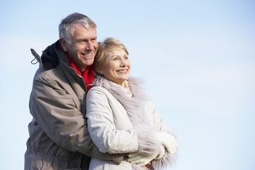 Senior Couple Embracing In Park