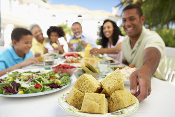 Family Eating An Al Fresco Meal